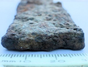 Remains of an Anglo Saxon hunting knife, known as a seax, pictured end-on, discovered in Swanbourne in 2012.  The circular structures  seen are indicative of it being forged by hammering together a cluster of heated iron rods.