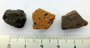Three early medieval gritty sandyware pot fragments.